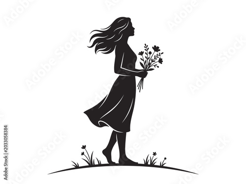 Silhouette of a woman walking in a meadow holding a bouquet of flowers.