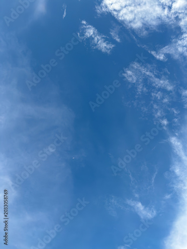 Photos Daytime firmament showcasing an endless sapphire gradient with translucent vapor