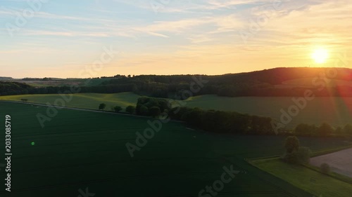 Aerial View of Fields and Forest at Golden Hour Sunset 