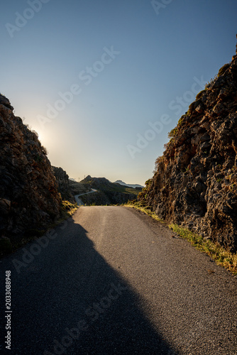 Sunrise scenery with winding road in the Cretan mountains
