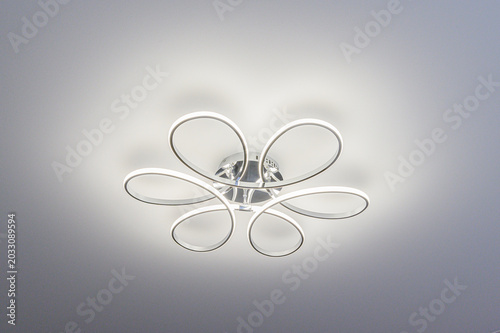 Photos modern chrome ceiling light fixture with six white LED rings arranged in a flora