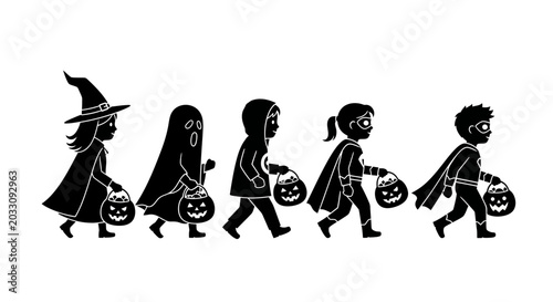 A group of children in Halloween costumes walking in a line.
