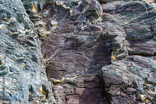 Tectonically deformed Devonian carbonate rock outcrop with brecciation and calcite veins along Tom River right bank