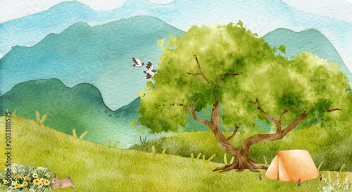Watercolor illustration of a peaceful mountain landscape with a camping tent, a large tree, and a cute rabbit in a grassy field.