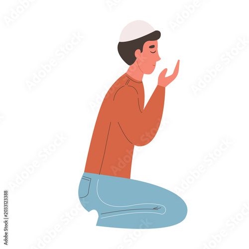 Fotografie Young person in prayer kneeling on floor with hands together in peaceful meditat