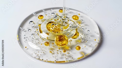 Closeup Macro Shot of Golden Bubbles in Clear Gel.