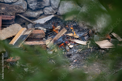 Cozy outdoor cooking atmosphere featuring fire flames