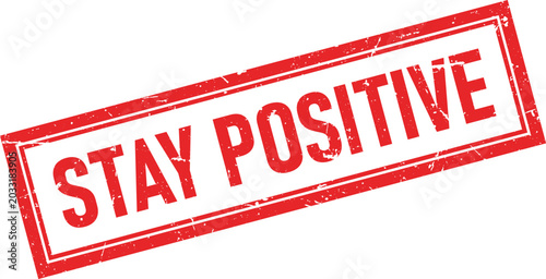 Foto Distressed red rubber stamp ink impression featuring the words Stay Positive in