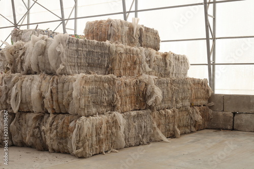Stored Bales of Compressed Plastic Waste- recycling concept