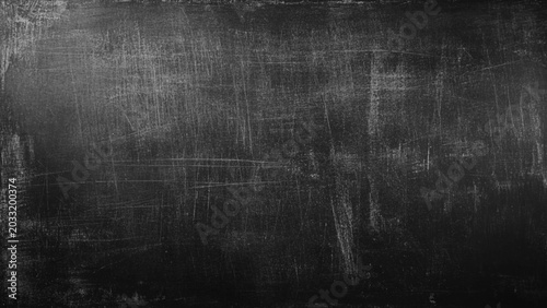 Abstract texture of chalk rubbed out on blackboard or chalkboard background. School education, dark wall backdrop or learning concept.