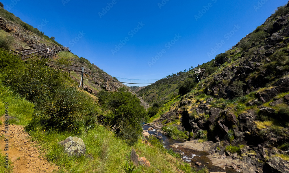 Fototapeta premium Barranco do Demo Boardwalk Over Rolling Hills, Algarve, Portugal