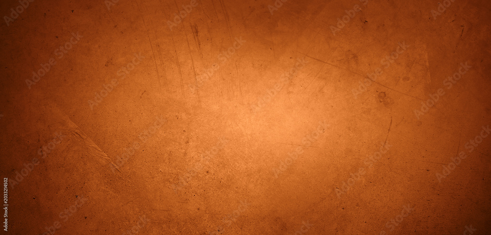 Fototapeta premium Orange textured concrete wall background