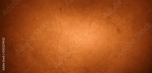 Photos Orange textured concrete wall background