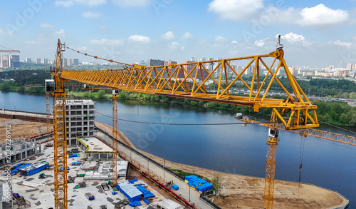 Yellow crane spans wide river