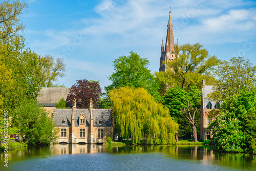 Morning view of canals and historic houses in Bruges