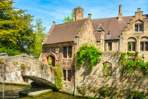 Morning view of canals and historic houses in Bruges