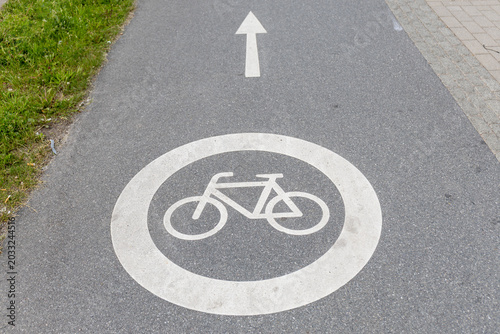 Bicycle path sign on the asphalt road