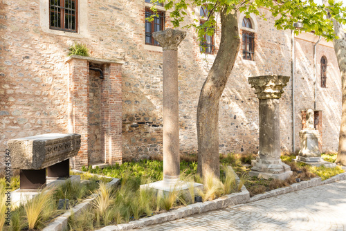 Canvas Print ISTANBUL, TURKEY - MAY 13, 2026: Ancient Roman and Byzantine ruins, including stone columns and a decorated sarcophagus, exhibited in the garden of the Istanbul Archaeology Museums