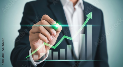 Growth and Success Conceptual Image of Businessman Drawing Rising Graph on Transparent Surface with Green Marker Showing Business Development