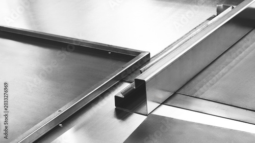 Canvastavla Shiny metal sheets lie on the table of an industrial laser cutting and bending machine