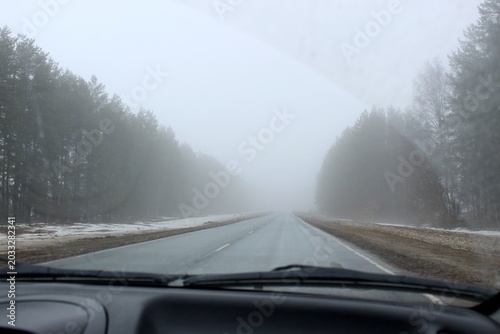 The route in early spring in the morning with thick fog.