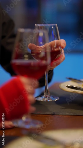 Two glasses of red wine at a table in a restaurant during a romantic dinner. Concept romantic dinner.
