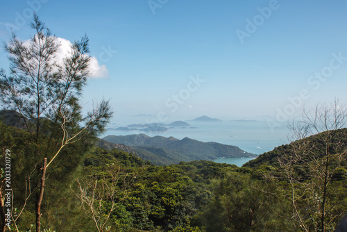 Photography Mountain landscape with green hills and distant islands near Hong Kong under blue sky with calm panoramic nature scenery
