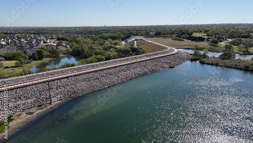 Foto Aerial park scene with dam, walkway, hiking trail, pond, hydroelectricity, etc