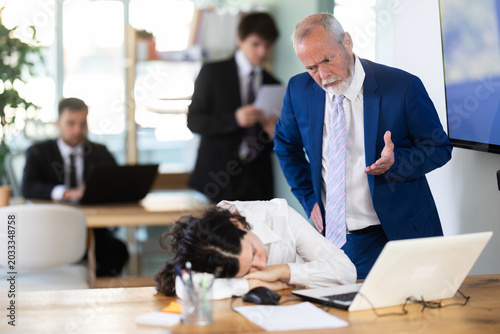Εκτύπωση καμβά Strict mature man boss scolding girl office worker for improper operation on lap