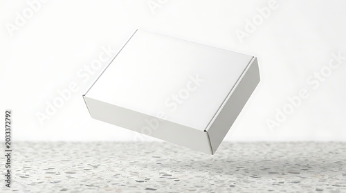 Isolated blank white cardboard apparel box floating above stone surface for e-commerce branding mockup delivery packaging