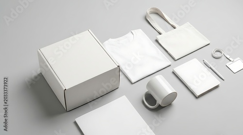 Blank promotional merchandise mockup set including cardboard box t-shirt tote bag mug notebook and stationery for branding