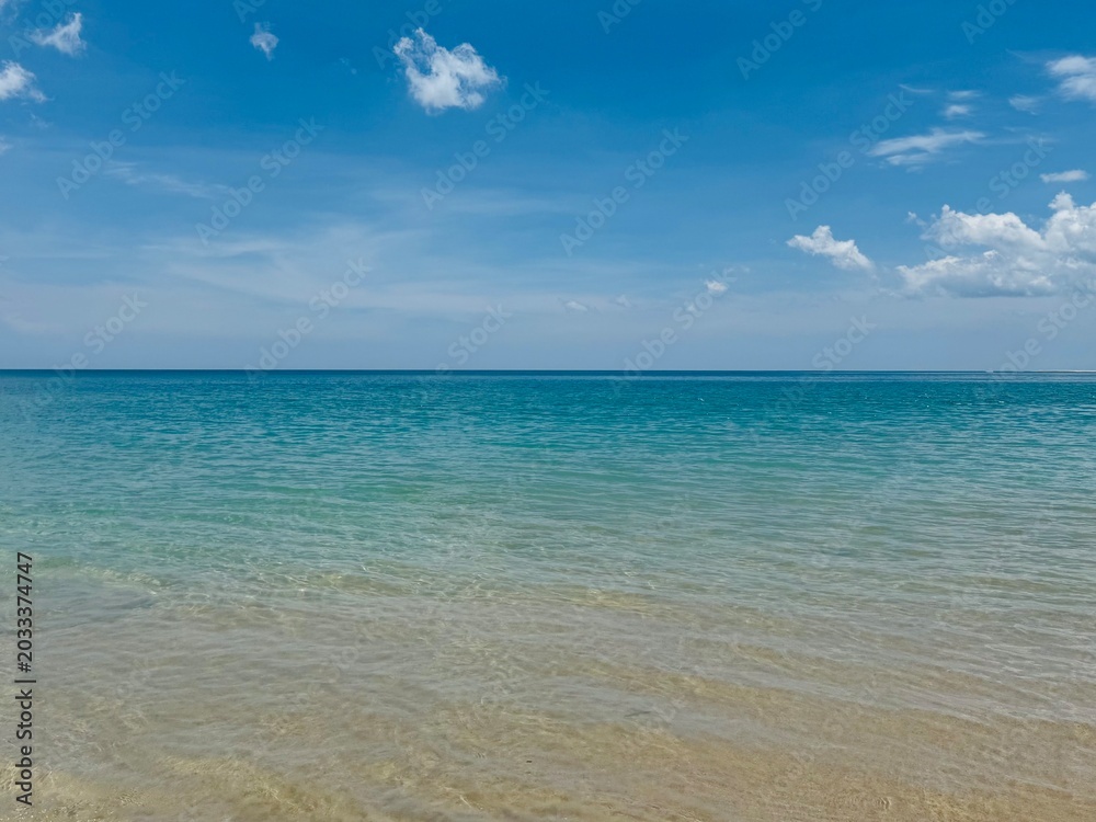 Fototapeta premium Calm turquoise sea Under cloudy sky