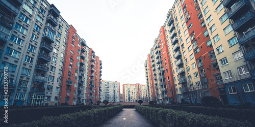 Colorful apartment buildings in urban residential complex courtyard