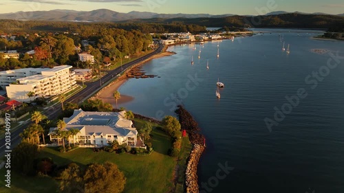 Aerial drone view of Batemans Bay on the NSW South Coast, Australia, looking to Clyde River Bridge and the CBD on a sunny early morning in May 2026   