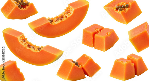 Ripe orange papaya slices and cubes with a hint of green skin, juicy, glistening, floating on a transparent background with copy space, soft studio light, healthy tropical fruit advertising concept