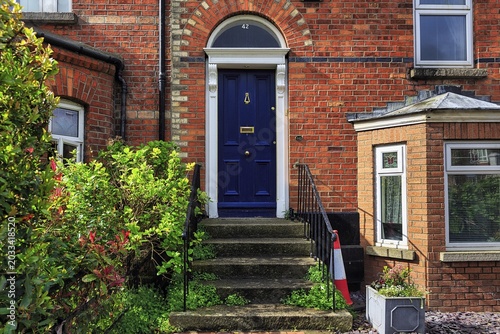 Blue door, house entrance with stairs, typical terraced house, Dublin, Ireland