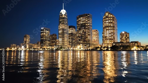 Modern City Skyline with Illuminated Skyscrapers at Night