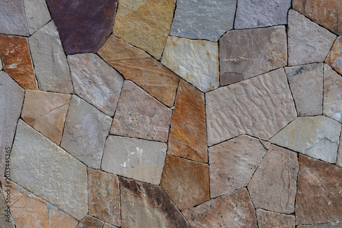 Foto Muro de piedra laja de diferentes tonos y tamaños con patrón irregular
