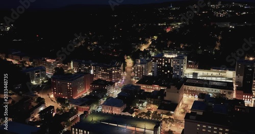 Ithaca, NY, USA - 05-18-2026  Night aerial hyperlapse video of downtown, commons, on a spring evening.