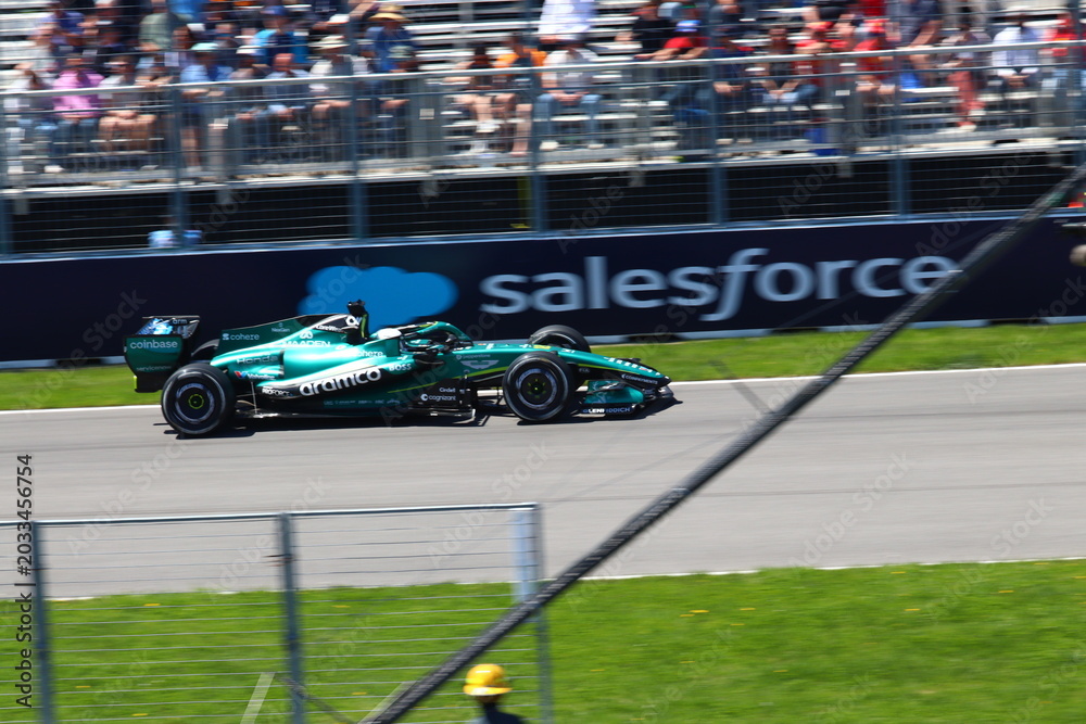 Naklejka premium May 24, 2026, Montreal, Canada, Mercedes F1 car racing through Circuit Gilles Villeneuve corner. g.