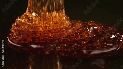 Slow Motion Golden Honey Pouring Seamless Background