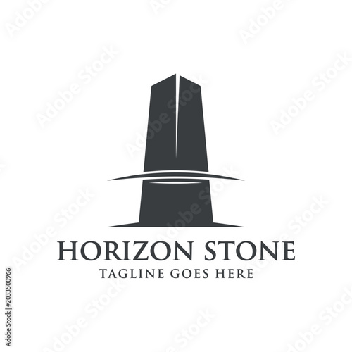 Fotografija Minimalist black monolithic stone tower logo for construction or architectural branding