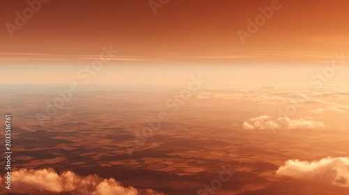 Aerial View of Orange Sunset Landscape Above Clouds
