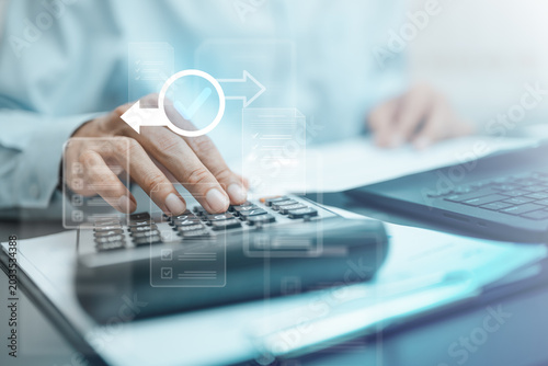 Bild auf Leinwand Refund and payment confirmation concept with tax calculation, approved transaction status, and financial document processing on calculator