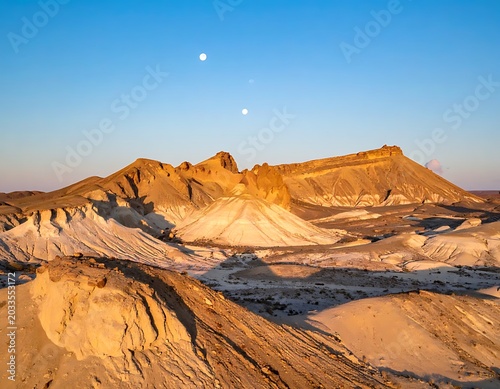 Desert landscape with moonlit sky