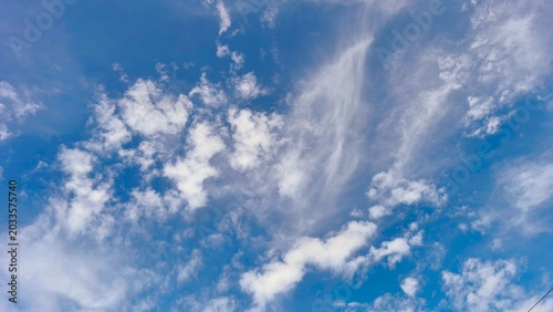 Dramatic Blue Sky with White Cumulus Clouds - Beautiful Fluffy Cloud Formation and Sunlight Rays, Natural Atmosphere Background for Nature and Landscape Photography