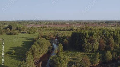 Aerial survey of forest by the river, flooded forest, forest at sunset