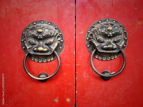 Obraz na płótnie Vintage Chinese door knockers on a red door.