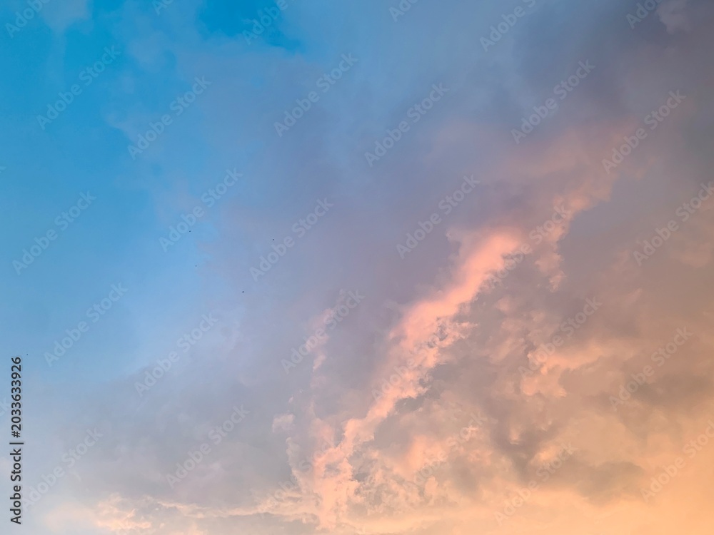 Fototapeta premium Cinematic pastel sunset clouds with soft gradient sky, captured in wide-angle focus for luxury wellness, meditation apps, inspirational branding, aesthetic wallpaper and social media themes.
