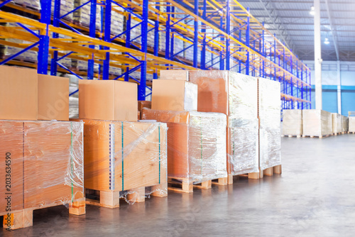 Bulk of Package Boxes Stacked on Pallets in Warehouse. Carton, Cardboard Boxes. Storage Warehouse. Supplies Shipment. Supply Chain, Shipping Warehouse Logistics.	
